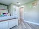 Comfortable bedroom featuring neutral walls, open closet, and soothing atmosphere for a peaceful night's rest at 111 Cardinal Ln, Eustis, FL 32726
