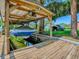 View of the boat lift and dock at 111 Cardinal Ln, Eustis, FL 32726