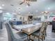 Open concept dining area, seamlessly connected to the modern kitchen and living room at 111 Cardinal Ln, Eustis, FL 32726