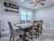 Elegant dining room with stylish furniture and ample natural light, perfect for gatherings at 111 Cardinal Ln, Eustis, FL 32726