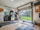Spacious garage features ample room for storage and a home gym setup at 111 Cardinal Ln, Eustis, FL 32726