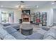 Spacious living room featuring a brick fireplace, large sectional, and stylish decor at 111 Cardinal Ln, Eustis, FL 32726