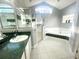 Large bathroom with tiled floors, garden tub, and glass shower stall at 11301 Via Mari Cae Ct, Clermont, FL 34711