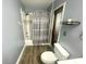 Bathroom featuring gray walls, wood look flooring, white vanity, and shower/tub at 11301 Via Mari Cae Ct, Clermont, FL 34711