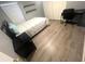 Bedroom with light wood flooring, desk, large window, and double door closet at 11301 Via Mari Cae Ct, Clermont, FL 34711