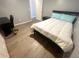 Bedroom features new wood flooring, natural light, and neutral colors at 11301 Via Mari Cae Ct, Clermont, FL 34711