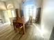 Bright dining room features a wooden table, chairs, and large windows allowing for lots of natural light at 11301 Via Mari Cae Ct, Clermont, FL 34711