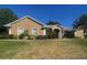 Inviting single-story home with stucco exterior, manicured landscaping, and a well-maintained front lawn at 11301 Via Mari Cae Ct, Clermont, FL 34711