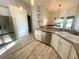A kitchen featuring stainless steel appliances, light countertops, and light wood flooring at 11301 Via Mari Cae Ct, Clermont, FL 34711