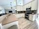 Open kitchen with a breakfast bar overlooking a living room and showcasing ample counter space and modern amenities at 11301 Via Mari Cae Ct, Clermont, FL 34711