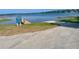 Lake view featuring the community's boat ramp, dock and lake access at 11301 Via Mari Cae Ct, Clermont, FL 34711