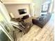 Spacious living room with comfortable seating, TV, and natural light from large windows at 11301 Via Mari Cae Ct, Clermont, FL 34711