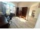 Sunny home office featuring large window and built-in bookshelves; perfect for work or study at 11301 Via Mari Cae Ct, Clermont, FL 34711