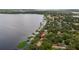 Panoramic aerial view of the lakefront property highlighting its prime location and serene waterfront setting at 12104 Elbert St, Clermont, FL 34711