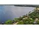 Breathtaking aerial view showcasing the lakefront property, with docks, lush greenery, and serene waterfront at 12104 Elbert St, Clermont, FL 34711