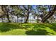 Scenic view of private lake with docks and lush green lawn at 12104 Elbert St, Clermont, FL 34711