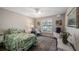 A cozy bedroom featuring a ceiling fan, soft natural light, and tasteful decor creating a peaceful retreat at 12104 Elbert St, Clermont, FL 34711