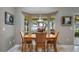 Inviting dining area with natural light and views of the water at 12104 Elbert St, Clermont, FL 34711