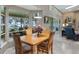 Dining area with view of the water, seamlessly connected to the living space at 12104 Elbert St, Clermont, FL 34711