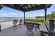 Charming covered dock offering seating, a table, and beautiful lake views at 12104 Elbert St, Clermont, FL 34711