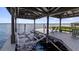 Well-equipped covered dock with boat lift and comfortable seating area overlooking the water at 12104 Elbert St, Clermont, FL 34711