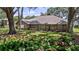 Charming brick home with beautiful landscaping and a well-manicured lawn at 12104 Elbert St, Clermont, FL 34711