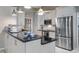 Stylish kitchen featuring stainless steel appliances, modern cabinetry, and a granite countertop at 12104 Elbert St, Clermont, FL 34711