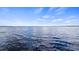 Scenic view of the serene lake under a beautiful blue sky with gentle ripples at 12104 Elbert St, Clermont, FL 34711
