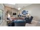 Bright living room with high ceilings, fireplace, tile floors, and comfortable seating arrangement at 12104 Elbert St, Clermont, FL 34711