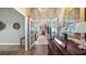 Bright living room with fireplace and French doors leading to another space with natural light at 12104 Elbert St, Clermont, FL 34711