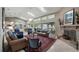 Spacious living area with high ceilings, skylights, brick fireplace and scenic outdoor views at 12104 Elbert St, Clermont, FL 34711