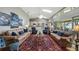 Open-concept living room with vaulted ceilings, bright light and view of lake beyond at 12104 Elbert St, Clermont, FL 34711