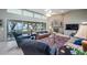 Comfortable living room features a fireplace, lake view, and inviting seating arrangement at 12104 Elbert St, Clermont, FL 34711