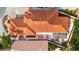 Home with red tile roof and well-manicured landscaping, screened in lanai at 1305 Santa Maria Ave, The Villages, FL 32159