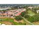 Aerial view of a residential community showcasing well-maintained homes and lush greenery at 1305 Santa Maria Ave, The Villages, FL 32159