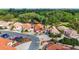 Lovely aerial view of a home in a gated community with lush landscaping and sidewalks at 1305 Santa Maria Ave, The Villages, FL 32159