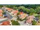 Beautiful aerial view of a home in a gated community with lush landscaping and scenic views at 1305 Santa Maria Ave, The Villages, FL 32159