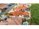 Aerial view of the property showcasing the roof, lanai, landscaping, and pool at 1305 Santa Maria Ave, The Villages, FL 32159