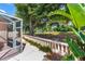 Scenic backyard view showcasing a lush golf course, mature trees, and serene patio at 1305 Santa Maria Ave, The Villages, FL 32159