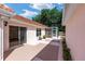 Outdoor patio with sliding glass doors leads to the screened-in lanai for relaxing at 1305 Santa Maria Ave, The Villages, FL 32159