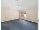 A bright bedroom with a ceiling fan and window with natural light; neutral walls and plush carpet at 1305 Santa Maria Ave, The Villages, FL 32159