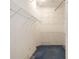 Walk-in closet with wire shelving and blue carpeting at 1305 Santa Maria Ave, The Villages, FL 32159