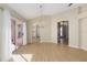 Bright dining room with wood floors, modern chandelier, and sliding glass doors to the patio at 1305 Santa Maria Ave, The Villages, FL 32159