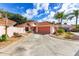 Charming single-story home with a tile roof, landscaped yard, and spacious driveway at 1305 Santa Maria Ave, The Villages, FL 32159