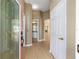 Bright foyer featuring tile flooring, access to bathroom, and open layout at 1305 Santa Maria Ave, The Villages, FL 32159