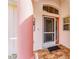 Inviting front entrance with decorative door, tile flooring, and neutral paint at 1305 Santa Maria Ave, The Villages, FL 32159