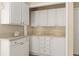 Detailed shot of the kitchen's white cabinets and light countertops at 1305 Santa Maria Ave, The Villages, FL 32159