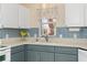 Close-up of the kitchen sink area with stainless steel faucet and tile backsplash at 1305 Santa Maria Ave, The Villages, FL 32159