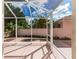 A covered and screened lanai with decorative features provides the ideal vantage of the backyard at 1305 Santa Maria Ave, The Villages, FL 32159