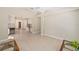 Open-concept living room boasts tile floors, high ceilings, and seamless flow into adjacent rooms at 1305 Santa Maria Ave, The Villages, FL 32159